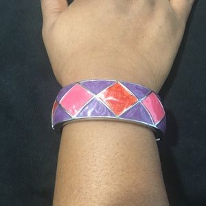 Multicolored metal bangle.
